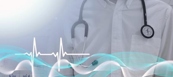 immagine di onde blu ed linea elettrocardio con dietro dottore